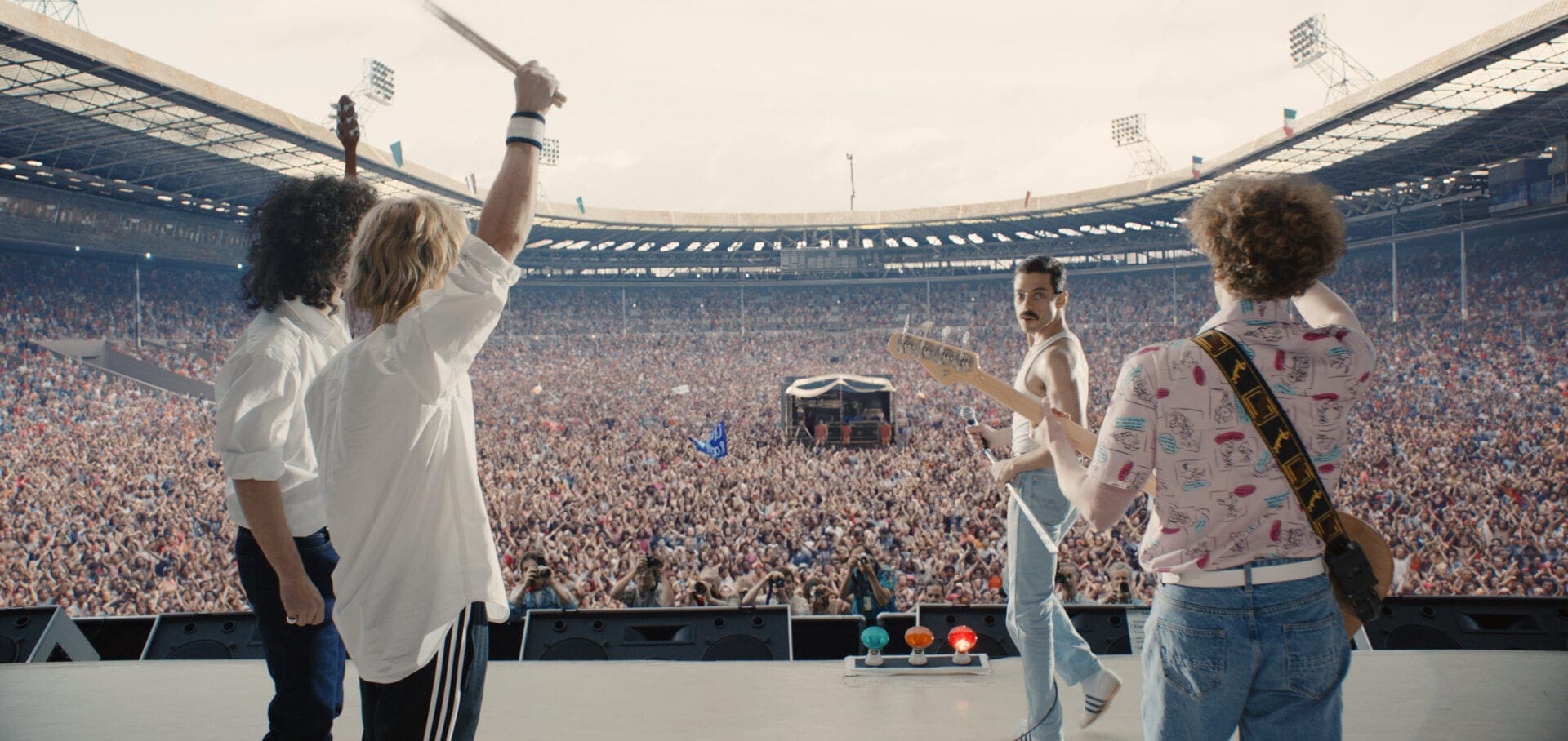 A group of people standing on top of a stage.