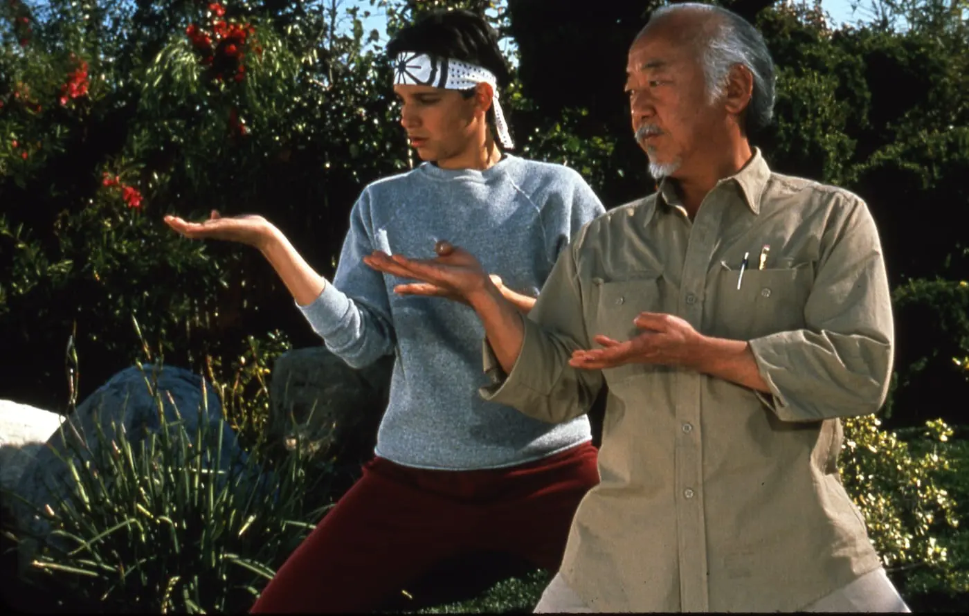 A man and woman are practicing martial arts.