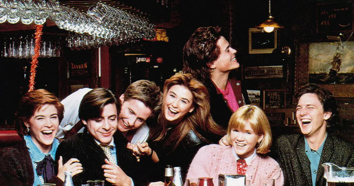 A group of people sitting at a table with drinks.