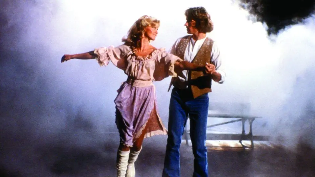 A man and a woman dancing in a smoky atmosphere.